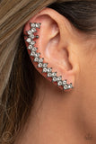 Let There Be LIGHTNING - Black - Paparazzi Accessories -   Item #P5PO-CRBK-158XX Encased in studded gunmetal fittings, pairs of glassy white rhinestones stack into a zigzagging frame up the ear for an electrifying fashion. Features a dainty cuff attached to the top for a secure fit.  Sold as one pair of ear crawlers.