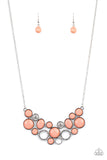 Extra Eloquent - Orange - Paparazzi Accessories -   Item #P2ST-OGXX-066XX A mismatched collection of faceted coral beaded frames and white rhinestone embellished accents delicately connect into a bubbly clustered pendant below the collar, creating a colorful statement piece. Features an adjustable clasp closure.  Sold as one individual necklace. Includes one pair of matching earrings.