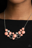 Extra Eloquent - Orange - Paparazzi Accessories -   Item #P2ST-OGXX-066XX A mismatched collection of faceted coral beaded frames and white rhinestone embellished accents delicately connect into a bubbly clustered pendant below the collar, creating a colorful statement piece. Features an adjustable clasp closure.  Sold as one individual necklace. Includes one pair of matching earrings.