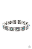 Cosmic Conquest - Blue - Paparazzi Accessories -  Item #P9WH-BLXX-245XX Dotted with iridescent blue rhinestone centers, studded silver frames alternate with pairs of dainty silver beads along stretchy bands, creating a stellar centerpiece around the wrist.  Sold as one individual bracelet.