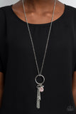 Unlock Your Sparkle - Pink - Paparazzi Accessories -  Item #P2RE-PKXX-300XX A pink teardrop gem, silver key, dainty crystal-like bead, and shimmery silver chain tassel swing from the bottom of a silver ring at the bottom of a lengthened silver chain, creating a whimsically tasseled display. Features an adjustable clasp closure.  Sold as one individual necklace. Includes one pair of matching earrings.