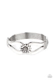 Let A Hundred SUNFLOWERS Bloom - Silver - Paparazzi Accessories -  Item #P9WH-SVXX-217XX Antiqued silver ribbons loop out from a decorative silver sunflower that attaches to a ribbed silver frame, creating a cuff-like bangle around the wrist. Features a hinged closure.  Sold as one individual bracelet.