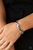 Craveable Curves - Silver - Paparazzi Accessories -  Item #P9BA-SVXX-120XX A flat silver bar delicately curls across a dainty gray shell-like acrylic cuff, creating a whimsical centerpiece around the wrist.  Sold as one individual bracelet.