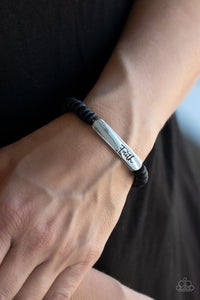 Full Faith - Black - Paparazzi Accessories -  Item #P9WD-URBK-472XX Distressed black wooden discs and a silver plate stamped in the phrase, "Faith," are threaded along a stretchy band around the wrist, creating an inspiring centerpiece.  Sold as one individual bracelet.