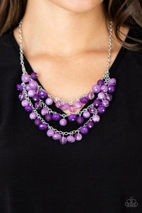 Fairytale Timelessness - Purple - Paparazzi Accessories -  Item #P2ST-PRXX-098XX Varying in shape and opacity, a mismatched collection of light and dark purple crystal-like beads drip from the shimmery silver chains, creating an enchanted layered fringe below the collar. Features an adjustable clasp closure.  Sold as one individual necklace. Includes one pair of matching earrings.