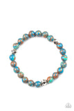 Awakened - Blue - Paparazzi Accessories -   Item #P9UR-BLXX-173XX Swirling with blue, green, and brown details, earthy beads and faceted silver accents are threaded along a stretchy band around the wrist for a tranquil look.  Sold as one individual bracelet.