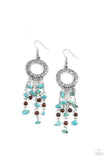 Primal Prestige - Blue - Paparazzi Accessories -  Item #P5SE-BLXX-262XX Tapered tassels of dainty wooden beads and turquoise pebbles stream from the bottom of a hammered silver hoop, creating an earthy fringe. Earring attaches to a standard fishhook fitting.  Sold as one pair of earrings.