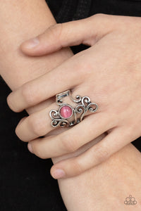 Glimmering Grapevines - Pink - Paparazzi Accessories -  Item #P4WH-PKXX-204XX Rustic silver filigree vines around a glowing pink cat's eye stone, creating a whimsically asymmetrical display across the finger. Features a stretchy band for a flexible fit.  Sold as one individual ring.