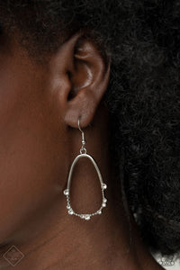 Ready or YACHT - White - Paparazzi Accessories -  Item #P5BA-WTXX-024ZT The bottom edge of an airy asymmetrical silver teardrop frame is studded and dotted in dainty white rhinestones, creating an elegant display. Earring attaches to a standard fishhook fitting.  Sold as one pair of earrings.