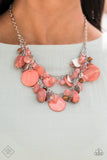 Spring Goddess - Orange - Paparazzi Accessories -  Item #P2ST-OGXX-080ZZ What better way to say "hello spring" than with this vibrant stunner? Double the fun with two layers of beads, baubles, stone, and wood in varying tones and finishes in the Pantone® of Burnt Coral, intermixed with sparkling, wavy silver discs gently swaying from a silver chain. Features an adjustable clasp closure.  Sold as one individual necklace. Includes one pair of matching earrings.  2021 APRIL FASHION FIX