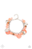 Springtime Springs - Orange - Paparazzi Accessories -  Item #P9ST-OGXX-009ZZ Springtime charms of shiny and soft beads and pearl-like discs in lovely tones of Burnt Coral sway from a silver chain. Accents of sparkly, wavy silver discs and wooden beads bring it down to earth as the fringe wraps around the wrist. Features an adjustable clasp closure..  Sold as one individual bracelet.  2021 APRIL FASHION FIX