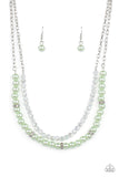 Parisian Princess - Green - Paparazzi Accessories -  Item #P2RE-GRXX-231XX A strand of glassy white crystal-like beads and pearly Green Ash beads and white rhinestone encrusted silver rings layer below the collar, creating a timeless display. Features an adjustable clasp closure.  Sold as one individual necklace. Includes one pair of matching earrings.