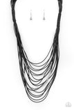 Nice CORD-ination - Black - Paparazzi Accessories -   Item #P2ST-BKXX-163XX Two rows of dainty silver beads and cylindrical rods are threaded along strands of shiny black cording that has been knotted in place, creating edgy rows across the chest. Features a magnetic closure.  Sold as one individual necklace. Includes one pair of matching earrings.