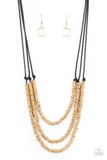 RING to Reason - Gold - Paparazzi Accessories -   Item #P2ED-GDXX-141XX A seemingly infinite collection of dainty gold rings are knotted in place along three black cords, creating edgy layers across the chest. Features an adjustable clasp closure.  Sold as one individual necklace. Includes one pair of matching earring