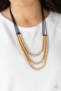 RING to Reason - Gold - Paparazzi Accessories -   Item #P2ED-GDXX-141XX A seemingly infinite collection of dainty gold rings are knotted in place along three black cords, creating edgy layers across the chest. Features an adjustable clasp closure.  Sold as one individual necklace. Includes one pair of matching earring