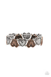 Rustic Heartthrob - Multi - Paparazzi Accessories -  Item #P9WH-MTXX-121XX Adorned in dainty floral accents, hammered copper and silver heart frames and classic silver beads are threaded along stretchy bands around the wrist for a romantically rustic look.  Sold as one individual bracelet.