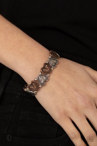 Rustic Heartthrob - Multi - Paparazzi Accessories -  Item #P9WH-MTXX-121XX Adorned in dainty floral accents, hammered copper and silver heart frames and classic silver beads are threaded along stretchy bands around the wrist for a romantically rustic look.  Sold as one individual bracelet.