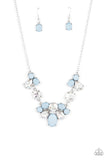 Ethereal Romance - Blue - Paparazzi Accessories -  Item #P2ST-BLXX-136XX Varying in opacity and shape, mismatched Cerulean beads attach to oversized white rhinestones, creating bubbly frames that delicately link into an ethereal display below the collar. Features an adjustable clasp closure.  Sold as one individual necklace. Includes one pair of matching earrings.