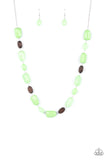 Meadow Escape - Green - Paparazzi Accessories -  Item #P2WH-GRXX-368XX Varying in opacity, a mixed assortment of faceted Apple Green beads delicately link with dainty wooden beads across the chest, creating a whimsically earthy display. Features an adjustable clasp closure.  Sold as one individual necklace. Includes one pair of matching earrings.