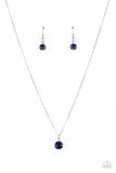 Undeniably Demure - Blue - Paparazzi Accessories -  Item #P2DA-BLXX-138XX A glittery blue rhinestone is fitted inside a pronged silver frame, creating a dramatically timeless pendant below the collar. Features an adjustable clasp closure.  Sold as one individual necklace. Includes one pair of matching earrings.