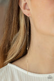 Dauntlessly Dainty - Gold - Paparazzi Accessories -  Item #P5PO-GDXX-132XX Pairs of dainty gold and pearly white seed beads trickle along a lengthened gold chain, creating an extended chandelier. Earring attaches to a standard post fitting.  Sold as one pair of post earrings.