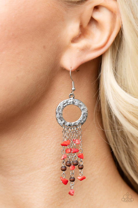 Primal Prestige - Red - Paparazzi Accessories -  Item #P5SE-RDXX-154XX Tapered tassels of dainty wooden beads and red pebbles stream from the bottom of a hammered silver hoop, creating an earthy fringe. Earring attaches to a standard fishhook fitting.  Sold as one pair of earrings.