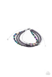 Holographic Hike - Multi - Paparazzi Accessories -   Item #P9UR-MTXX-205XX A mismatched collection of oil spill beads, purple wooden beads, and iridescent crystal-like beads are threaded along gray threaded and glittery purple leather cording, creating stellar layers around the wrist. Features an adjustable sliding knot closure.  Sold as one individual bracelet.