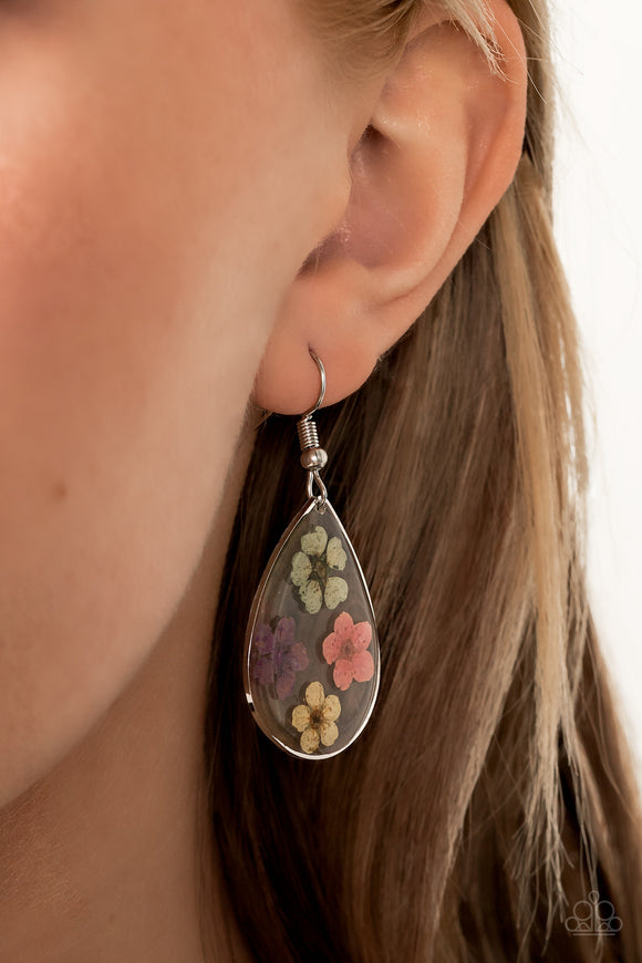 Perennial Prairie - Multi - Paparazzi Accessories -  Item #P5SE-MTXX-120XX Dainty green, pink, purple, and yellow flowers are encased in a glassy teardrop, creating a whimsical frame. Earring attaches to a standard fishhook fitting.  Sold as one pair of earrings.