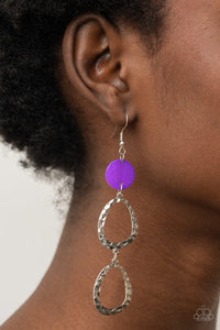 Surfside Shimmer - Purple - Paparazzi Accessories - Item #P5WH-PRXX-239XX A pearly purple shell disc anchors to two shiny hammered silver asymmetrical hoops as they dangle from the ear creating a dazzling lure. Earring attaches to a standard fishhook fitting.  Sold as one pair of earrings.