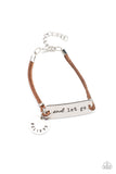 Believe and Let Go - Brown - Paparazzi Accessories -  Item #P9WD-URBN-560XX An antiqued disc stamped in the word, "believe" and a silver plate stamped in the phrase, "and let go," are knotted in place around the wrist with layers of brown suede cording, creating a motivational centerpiece. Features an adjustable clasp closure.  Sold as one individual bracelet. Inspiratoinal jewelry