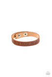 Life is Tough - Brown - Paparazzi Accessories -  Item #P9WD-URBN-563XX A dainty brown leather band is stamped in the phrase, "Life is tough. So Are You.," creating an inspiring centerpiece around the wrist. Features an adjustable snap closure.  Sold as one individual bracelet.