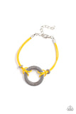 Choose Happy - Yellow - Paparazzi Accessories -  Item #P9WD-URYW-073XX Infused with studded silver beads, yellow leathery cords knot around a silver ring stamped in the phrase, "Choose Happy," creating a motivational centerpiece around the wrist. Features an adjustable clasp closure.  Sold as one individual bracelet.