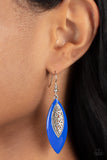 Venetian Vanity - Blue - Paparazzi Accessories -  Item #P5WH-BLXX-251XX Asymmetrically bordered in a bright Mykonos Blue frame, airy silver filigree blooms along the center of a colorful lure for a seasonal flair. Earring attaches to a standard fishhook fitting.  Sold as one pair of earrings.