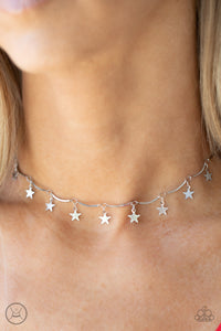 Little Miss Americana - Silver - Paparazzi Accessories -  Item #P2CH-SVXX-072CF A collection of dainty silver stars and curved silver bars delicately connect around the neck, creating a stellar fringe. Features an adjustable clasp closure.  Sold as one individual necklace. Includes one pair of matching earrings.