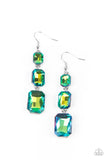 Cosmic Red Carpet - Green - Paparazzi Accessories -  Item #P5RE-GRXX-160XX Featuring a dazzling green and gold UV shimmer, a trio of emerald-cut gems in graduating sizes is linked one below the other for a dramatic red carpet finish. Earring attaches to a standard fishhook fitting.  Sold as one pair of earrings.