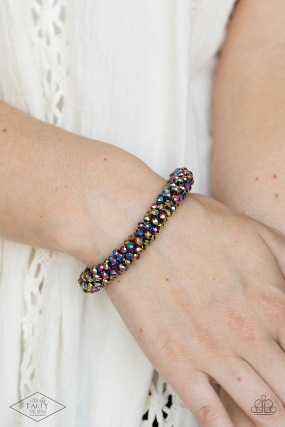 Wake Up and Sparkle - Multi - Paparazzi Accessories -  Item #P9ED-MTXX-039XX Sparkling with dramatic brilliance, a collection of faceted dainty oil spill beads are threaded along a woven stretchy band creating a stunning statement around the wrist.  Sold as one individual bracelet. BLACK DIAMOND EXCLUSIVE