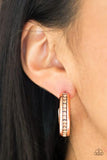 5th Avenue Fashionista - Copper - Paparazzi Accessories -  PHSO-CPSH-O93XX  A row of glassy topaz rhinestones is encrusted down the spine of a shiny copper hoop for a refined look. Earring attaches to a standard post fitting. Hoop measures 1 1/4" in diameter.  Sold as one pair of hoop earrings at DeesBlings.com - Affordable Fashion Jewelry that is Lead and Nickel free.