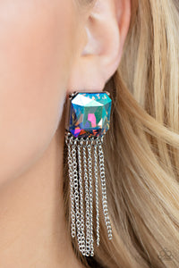 Supernova Novelty - Multi - Paparazzi Accessories -  Item #P5PO-MTXX-065XX Featuring a stellar UV shimmer, an oversized radiant cut gem is pressed into a pronged silver fitting that gives way to a tapered curtain of silver chains for an out-of-this-world finish. Earring attaches to a standard post fitting.  Sold as one pair of post earrings.