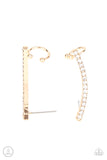 Give Me The SWOOP - Gold - Paparazzi Accessories -   Item #P5PO-CRGD-165XX A dainty row of glassy white rhinestones are encrusted along a glistening gold bar that swoops up the ear for a sparkly style. Features a dainty cuff attached to the top for a secure fit.  Sold as one pair of ear crawlers.