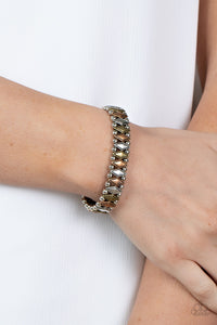 Abstract Advisory - Multi - Paparazzi Accessories -  Item #P9SE-MTXX-160XX Brushed in an antiqued shimmer, pairs of dainty silver beads flank diamond shaped brass, copper, and silver beads along stretchy bands around the wrist for a rustic fashion.  Sold as one individual bracelet.