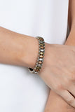 Abstract Advisory - Multi - Paparazzi Accessories -  Item #P9SE-MTXX-160XX Brushed in an antiqued shimmer, pairs of dainty silver beads flank diamond shaped brass, copper, and silver beads along stretchy bands around the wrist for a rustic fashion.  Sold as one individual bracelet.