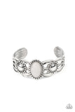 Solar Solstice - White - Paparazzi Accessories -  Item #P9SE-WTXX-227XX An oval white stone is pressed into the center of a studded silver frame atop an airy silver cuff embellished in studded sun-like frames for an earthy pop of seasonal color around the wrist.  Sold as one individual bracelet.