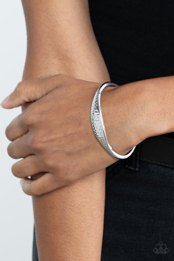 Ancient Accolade - Silver - Paparazzi Accessories -  Item #P9BA-SVXX-132XX The center of a dainty silver cuff is flattened and hammered in antiqued details, creating a chic rustic centerpiece around the wrist.  Sold as one individual bracelet.