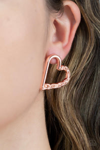 Cupid, Who? - Copper - Paparazzi Accessories -  Item #P5PO-CPSH-042XX One side of a shiny copper heart frame is subtlety twisted with twinkly texture, creating a romantic display. Earring attaches to a standard post fitting.  Sold as one pair of post earrings.