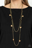 Chicly Cupid - Brass - Paparazzi Accessories -  Item #P2WH-BRXX-152XX Airy brass heart frames delicately link with sections of antiqued brass chains across the chest, creating flirtatious layers. Solid brass heart charms whimsically swing from the display, reminiscent of vintage inspired lockets. Features an adjustable clasp closure.  Sold as one individual necklace. Includes one pair of matching earrings.