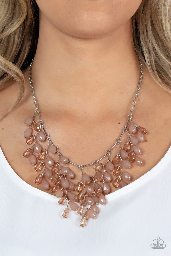 Garden Fairytale - Brown - Paparazzi Accessories -  Item #P2ST-BNXX-071XX A shimmery collection of opaque and clear crystal-like brown teardrop beads delicately cluster along a linked strand of silver bars, creating an ethereally leafy fringe below the collar. Features an adjustable clasp closure.  Sold as one individual necklace. Includes one pair of matching earrings.