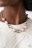 Nautical Nirvana - Pink - Paparazzi Accessories -  Item #P2RE-PKXX-348EO A collection of classic white pearls, iridescent Pale Rosette beads, white emerald cut gems, and iridescent crystal-like teardrops dance below the collar for an ethereal display. Shiny silver frames encase each bead, adding a romantic vibe to the vintage inspired design. Features an adjustable clasp closure.  Sold as one individual necklace. Includes one pair of matching earrings.