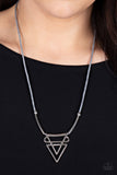 Tulum Totem - Silver - Paparazzi Accessories -  Item #P2SE-SVXX-160XX Classic smooth bars twist together to form a double-layered arrow that dips below the collar. Accented with classic silver beads and cylinders, an Ultimate Gray cord completes the fashionably modern look. Features an adjustable clasp closure.  Sold as one individual necklace. Includes one pair of matching earrings.