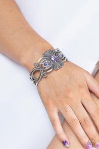 Rural Rumination - Purple - Paparazzi Accessories -  Item #P9SE-PRXX-170XX Purple faux stone beads adorn the flared center of a frilly silver cuff layered with whirling smooth and textured silver filigree, creating a whimsical pop of color atop the wrist.  Sold as one individual bracelet.