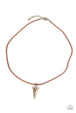 Pharaohs Arrow - Brass - Paparazzi Accessories -  Item #P2MN-URBR-020XX A brass arrowhead inspired pendant glides along a leathery brown cord below the collar, creating authentic edge. Features an adjustable clasp closure.  Sold as one individual necklace.